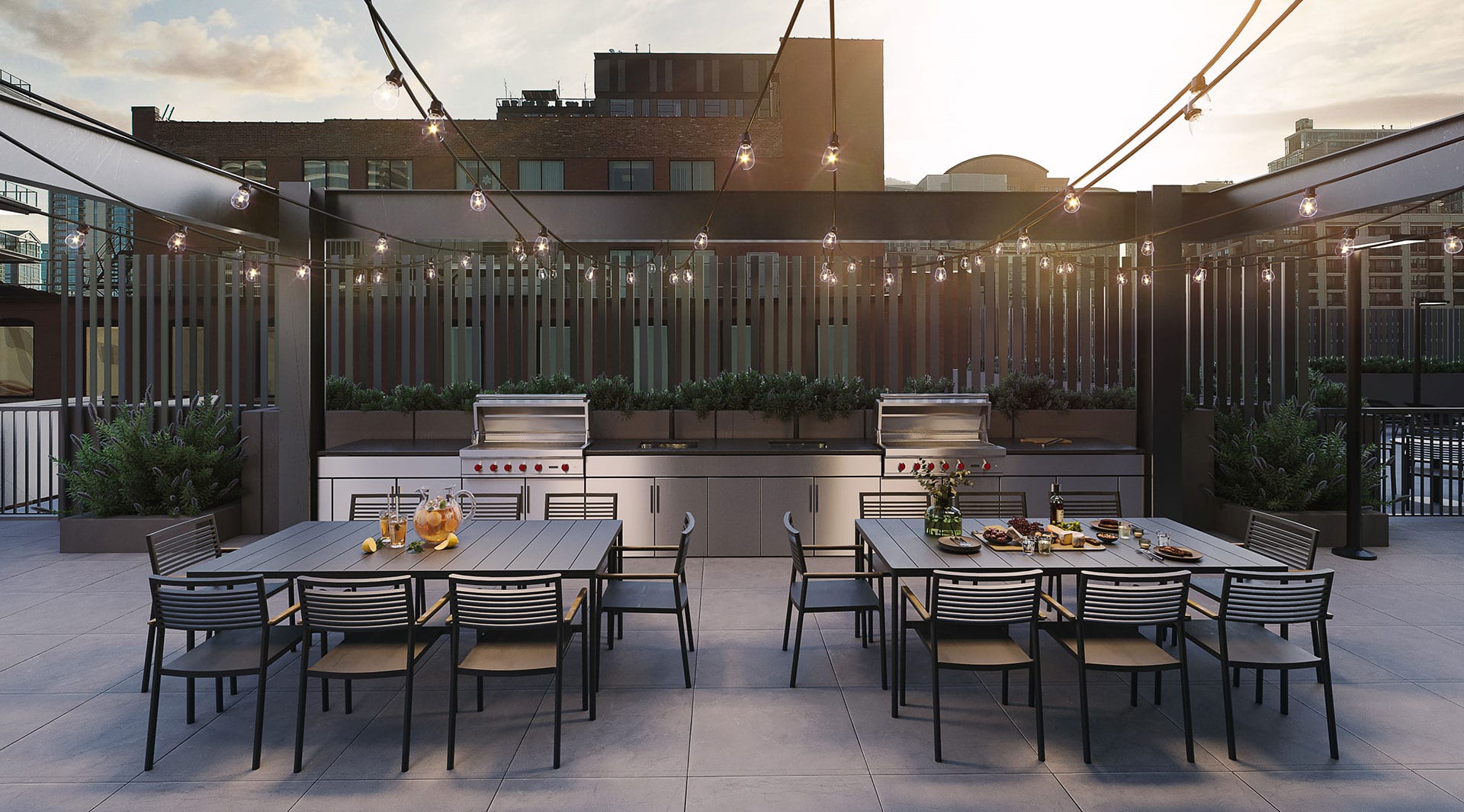 exterior amenity deck with patio seating, tables, string lights, flowers and plants, and grills